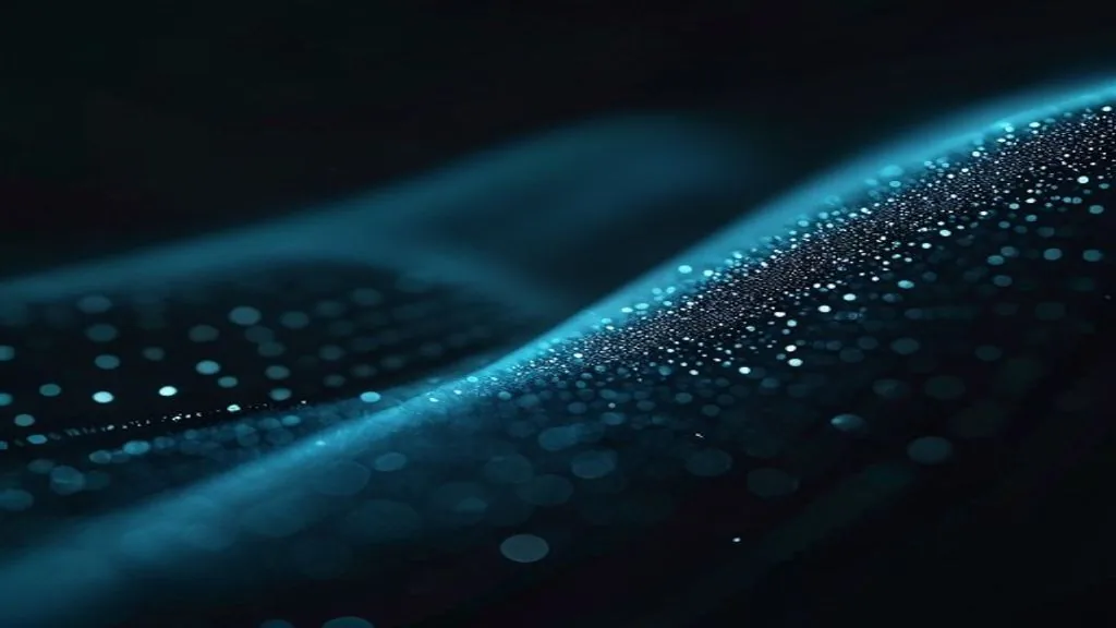 Single dotted curve traced across a dark matte surface under low side light, suggesting a spectrum