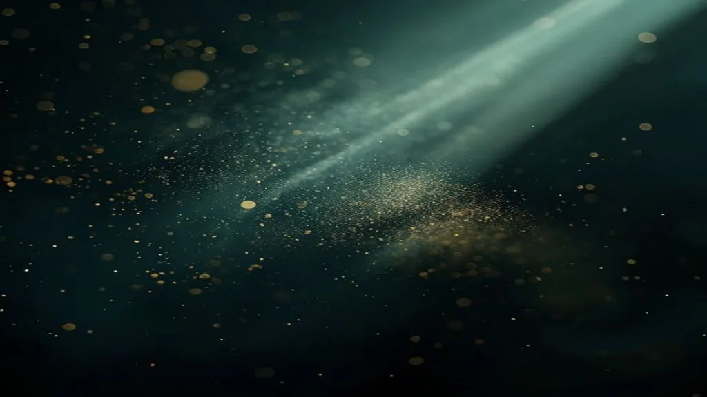 A single diagonal beam of golden light cutting through deep darkness, illuminating drifting motes of dust