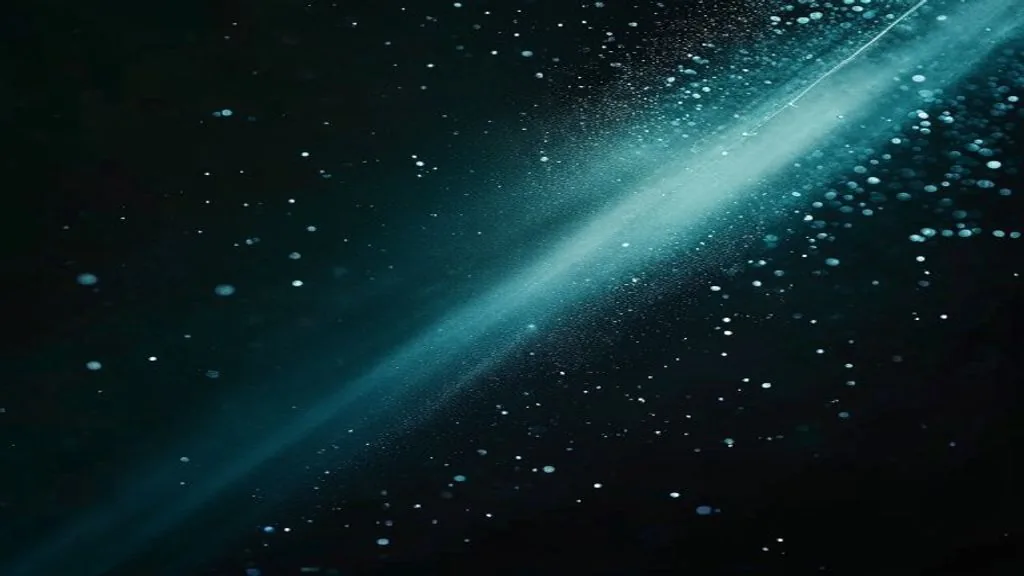 A single beam of light passing through a glass surface against a dark background